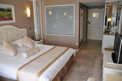 Imagen de la habitación del Hotel Geneva, Tianjin. Foto 9