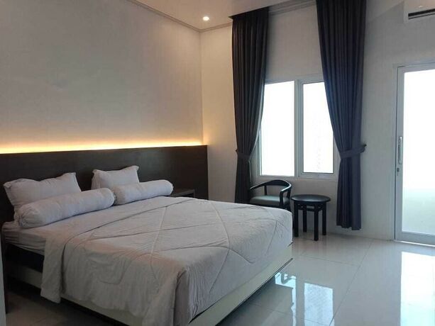 Imagen de la habitación del Hotel Genio Syariah Solo. Foto 6