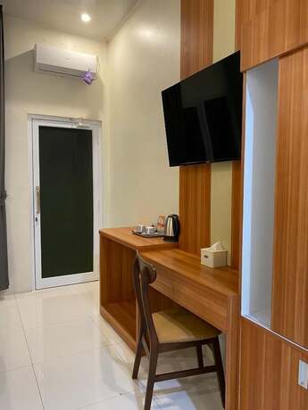 Imagen de la habitación del Hotel Genio Syariah Solo. Foto 8