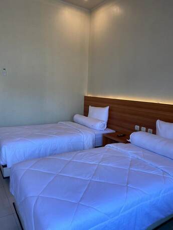 Imagen de la habitación del Hotel Genio Syariah Solo. Foto 10