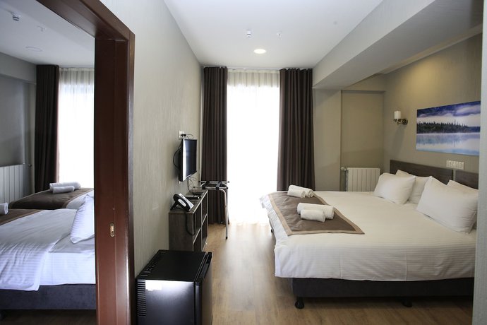 Imagen de la habitación del Hotel GeoGraphy. Foto 17