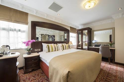 Imagen de la habitación del Hotel George Street. Foto 7