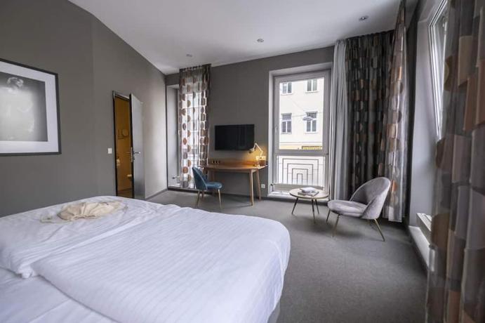 Imagen de la habitación del Hotel George Vienna. Foto 8