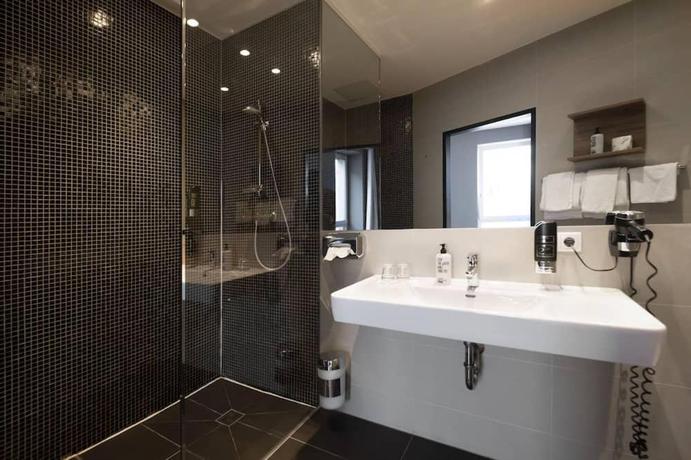 Imagen de la habitación del Hotel George Vienna. Foto 11