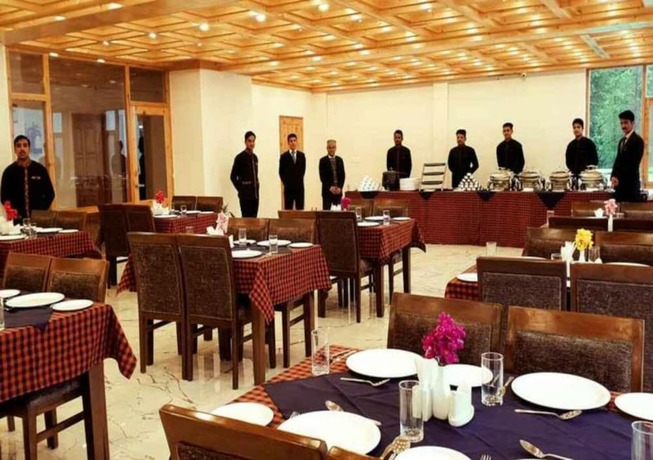 Imagen del bar/restaurante del Hotel Gezellig Inn - Vardhan Hills. Foto 10