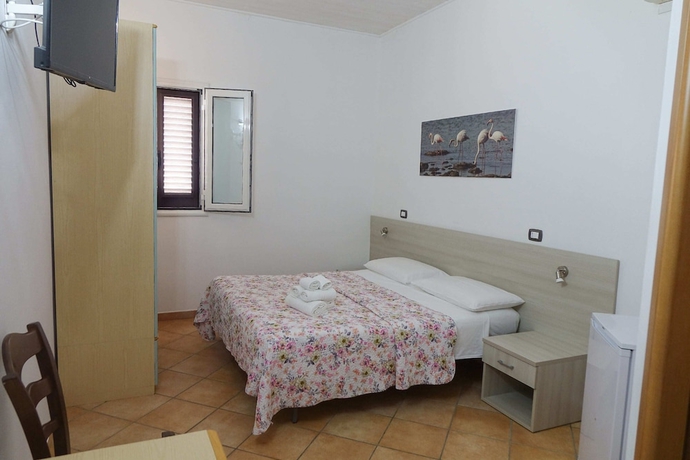 Imagen de la habitación del Hotel Giardini Sausari Residence. Foto 8