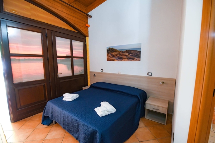 Imagen de la habitación del Hotel Giardini Sausari Residence. Foto 9