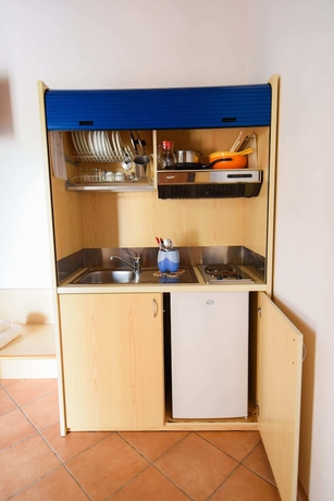 Imagen de la habitación del Hotel Giardini Sausari Residence. Foto 12