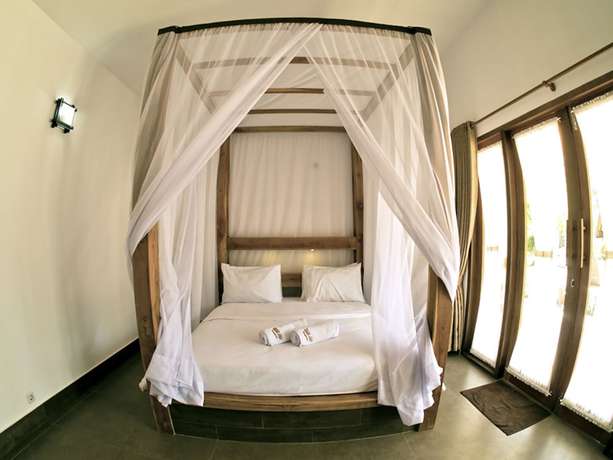 Imagen de la habitación del Hotel Gili Air Bungalows. Foto 18