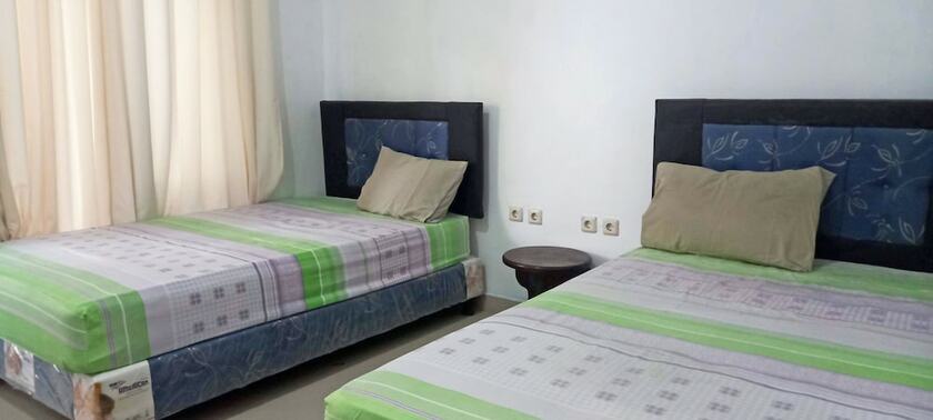 Imagen de la habitación del Hotel Gili Welldone Guesthouse. Foto 14