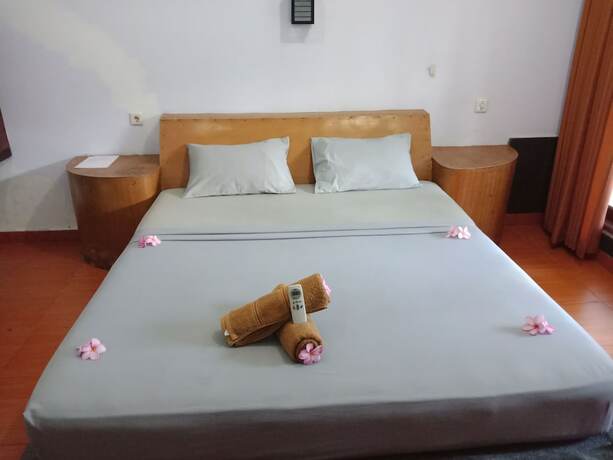 Imagen de la habitación del Hotel Gili Welldone Guesthouse. Foto 15