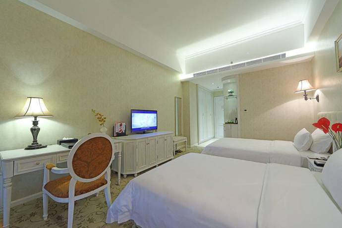 Imagen de la habitación del Hotel Gin Mao Yuan Shenzhen. Foto 7