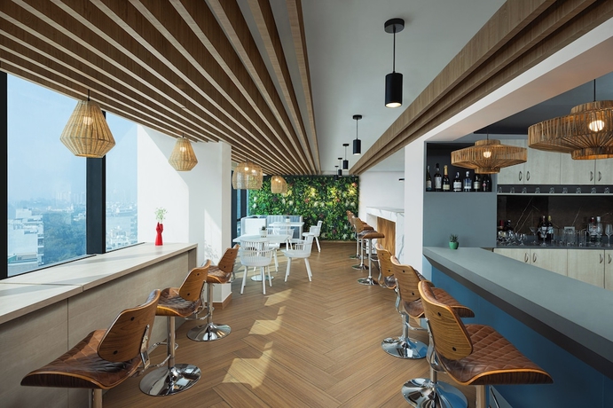 Imagen del bar/restaurante del Hotel Ginger Gurugram Sector 1. Foto 2
