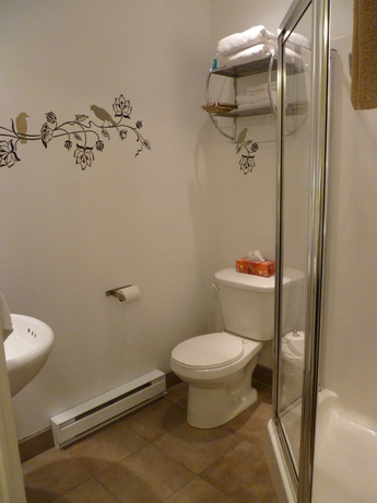 Imagen de la habitación del Hotel Gingerbread Manor. Foto 6