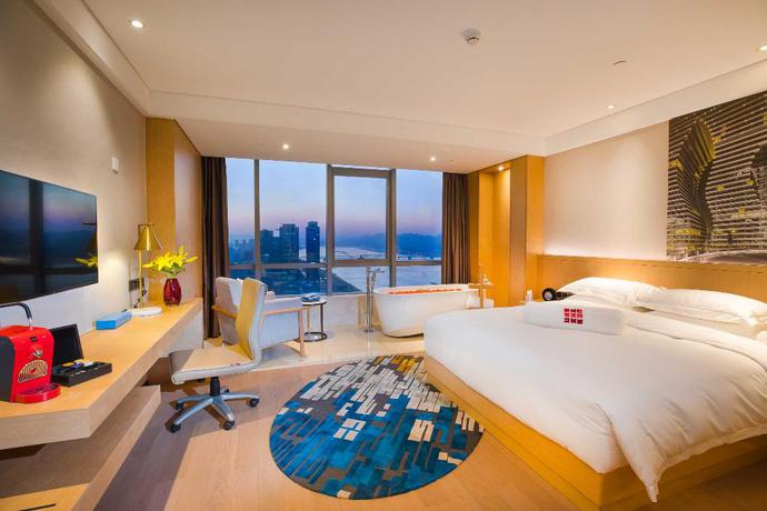 Imagen de la habitación del Hotel GinlanJIA Yuntai Impression Hotel. Foto 11