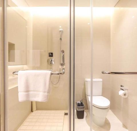 Imagen de la habitación del Hotel GinlanJIA Yuntai Impression Hotel. Foto 12