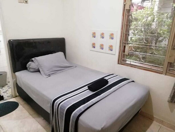 Imagen de la habitación del Hotel Gio Guesthouse Bogor. Foto 20
