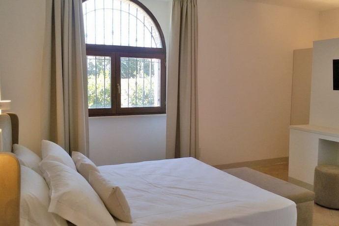 Imagen de la habitación del Hotel Giotto Luxury Country House. Foto 2