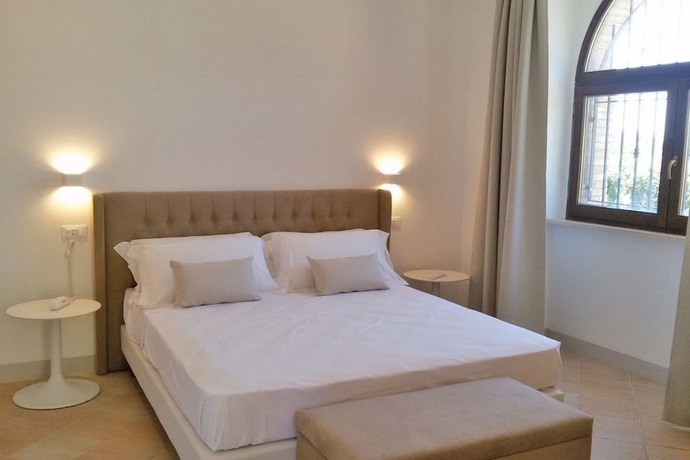 Imagen de la habitación del Hotel Giotto Luxury Country House. Foto 6