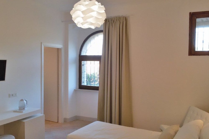Imagen de la habitación del Hotel Giotto Luxury Country House. Foto 7