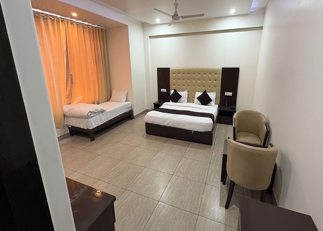 Imagen de la habitación del Hotel Girraj Inn. Foto 7
