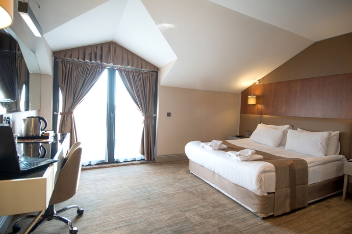 Imagen de la habitación del Hotel Gk Regency Suites. Foto 11