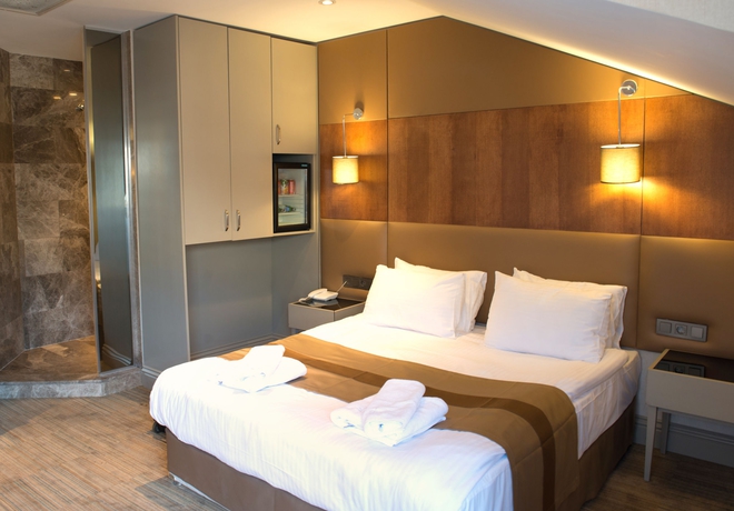 Imagen de la habitación del Hotel Gk Regency Suites. Foto 12