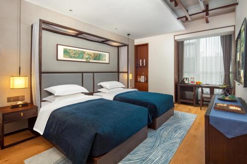 Imagen de la habitación del Hotel Glean Xinzhou. Foto 14