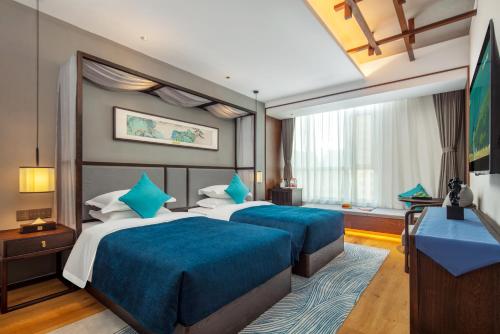 Imagen de la habitación del Hotel Glean Xinzhou. Foto 15