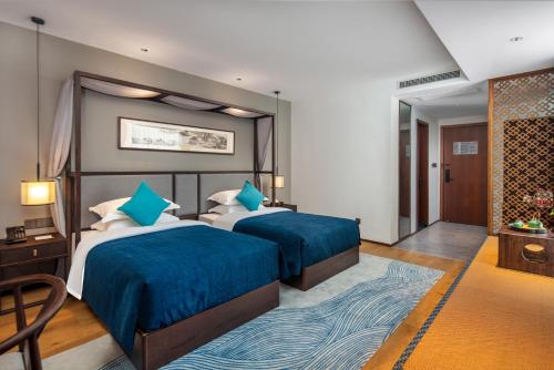 Imagen de la habitación del Hotel Glean Xinzhou. Foto 19