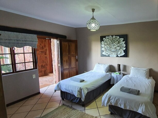 Imagen de la habitación del Hotel Glen Afric Country Lodge. Foto 17