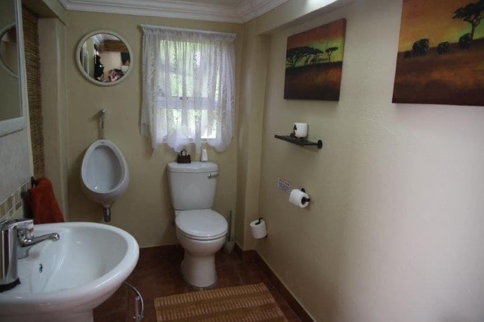 Imagen de la habitación del Hotel Glenda S Guest Suites. Foto 8