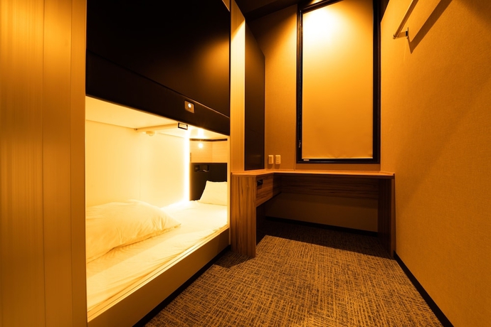 Imagen de la habitación del Hotel Global Cabin Yokohama Chukagai. Foto 2