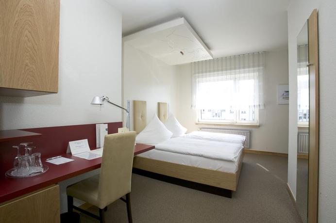 Imagen de la habitación del Hotel Global Inn. Foto 4