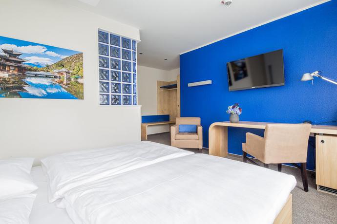 Imagen de la habitación del Hotel Global Inn. Foto 8