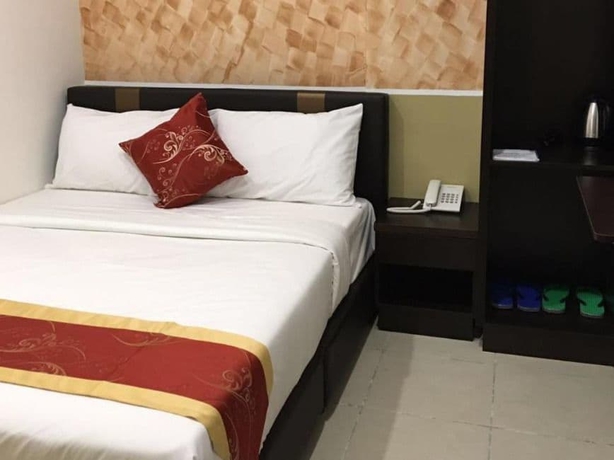 Imagen de la habitación del Hotel Global Inn. Foto 5