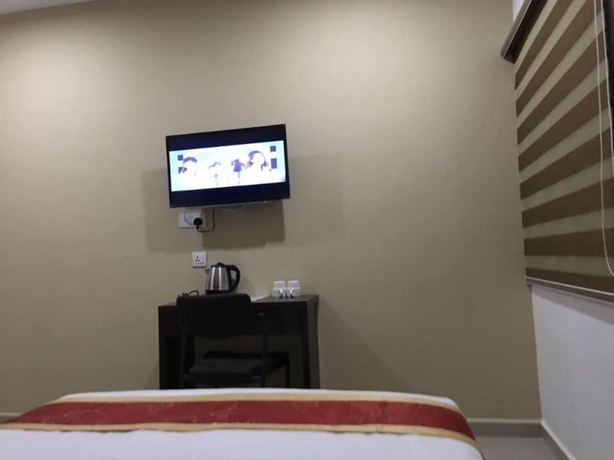 Imagen de la habitación del Hotel Global Inn. Foto 8