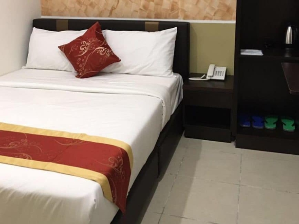 Imagen de la habitación del Hotel Global Inn. Foto 11