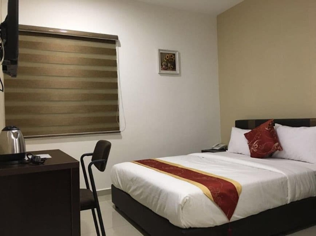 Imagen de la habitación del Hotel Global Inn. Foto 12