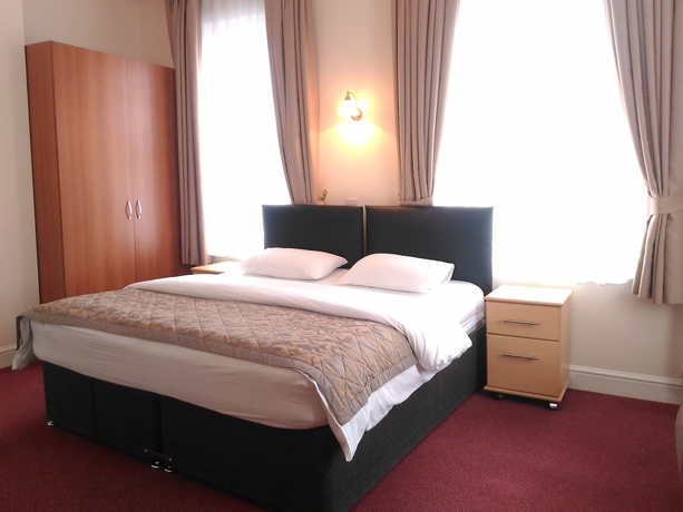 Imagen de la habitación del Hotel Global Lodge. Foto 7