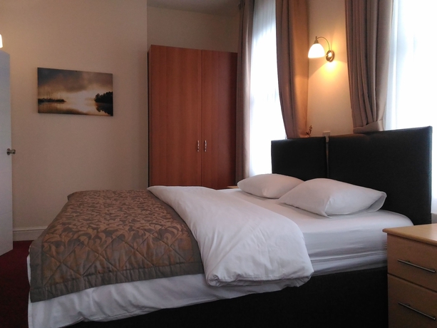 Imagen de la habitación del Hotel Global Lodge. Foto 9