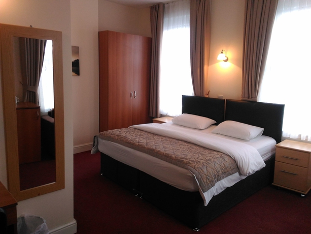 Imagen de la habitación del Hotel Global Lodge. Foto 10