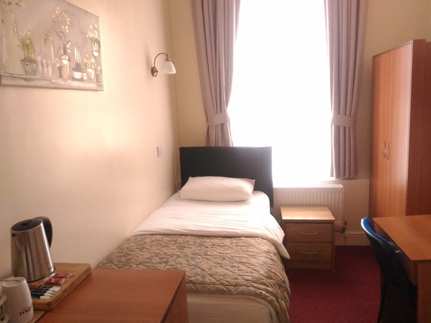 Imagen de la habitación del Hotel Global Lodge. Foto 16