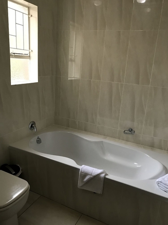 Imagen de la habitación del Hotel Global Village Guest House. Foto 17