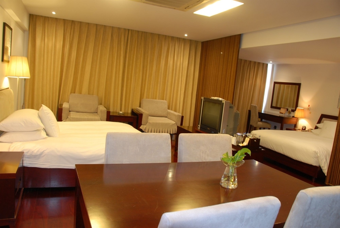 Imagen de la habitación del Hotel Gloria Plaza Kangqiao Shanghai. Foto 2