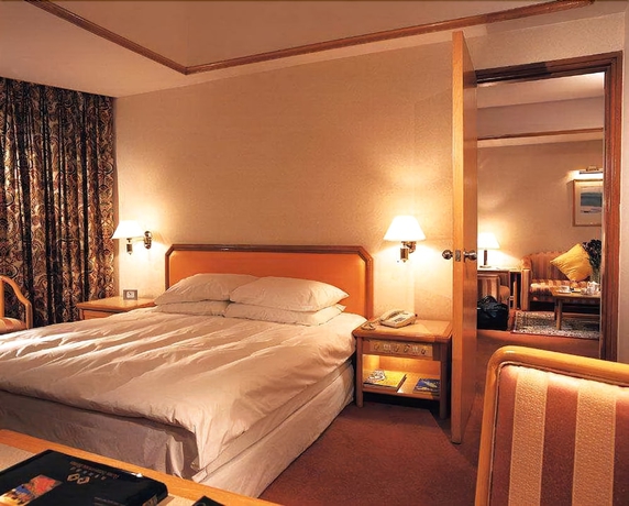 Imagen de la habitación del Hotel Gloria Plaza Shenyang. Foto 10