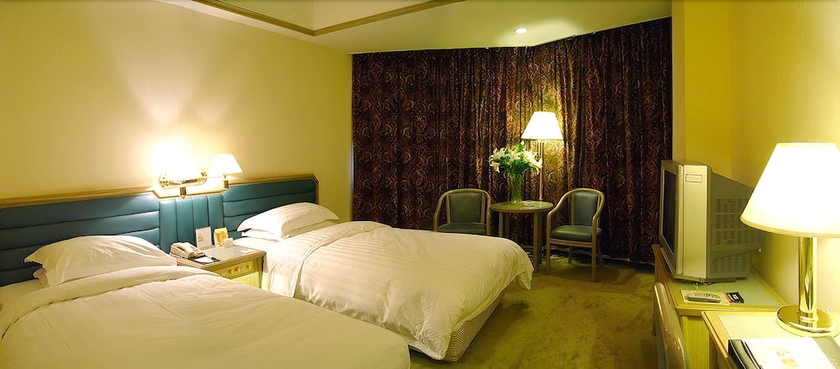 Imagen de la habitación del Hotel Gloria Plaza Shenyang. Foto 12
