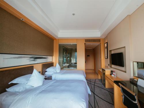 Imagen de la habitación del Hotel Gloria Resorts Jingdezhen Xishan Lake. Foto 8