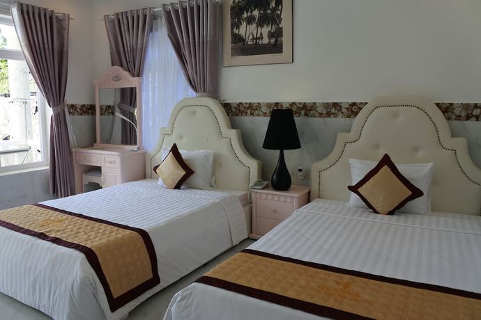 Imagen de la habitación del Hotel Godiva Phu Quoc. Foto 17