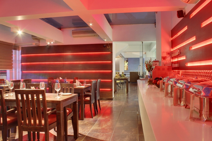 Imagen del bar/restaurante del Hotel Godwin Deluxe. Foto 4